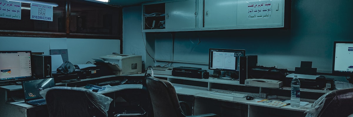 Operations floor with rows of workstations in cool light